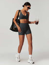 Maskert Criss-Cross Back Tank & Sculpted Leggings Set Volcanic Grey model carried a bag and held a coffee.